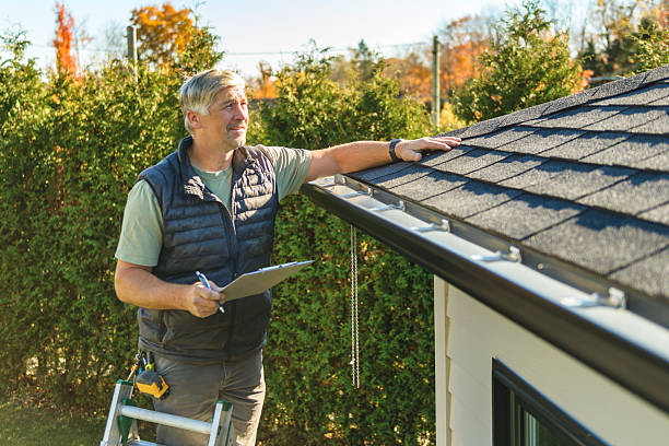 Professional Hail Damage Roof Repair technician working in Brighton, AL